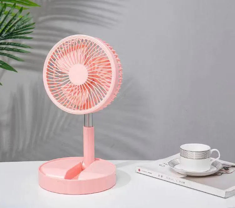 Black telescopic portable folding fan shown extended to full height on a desk, with control panel visible.