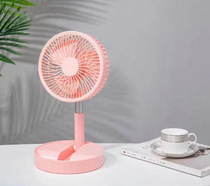 Black telescopic portable folding fan shown extended to full height on a desk, with control panel visible.