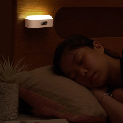 White magnetic mount USB rechargeable LED night light with motion sensor and touch control panel.