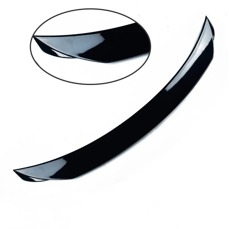 Mazda 3 Axela Exela tail trim in bright black with large fixed wind surround, showing precise fitment on vehicle rear