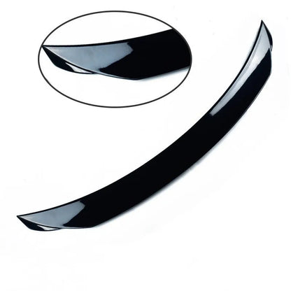 Mazda 3 Axela Exela tail trim in bright black with large fixed wind surround, showing precise fitment on vehicle rear