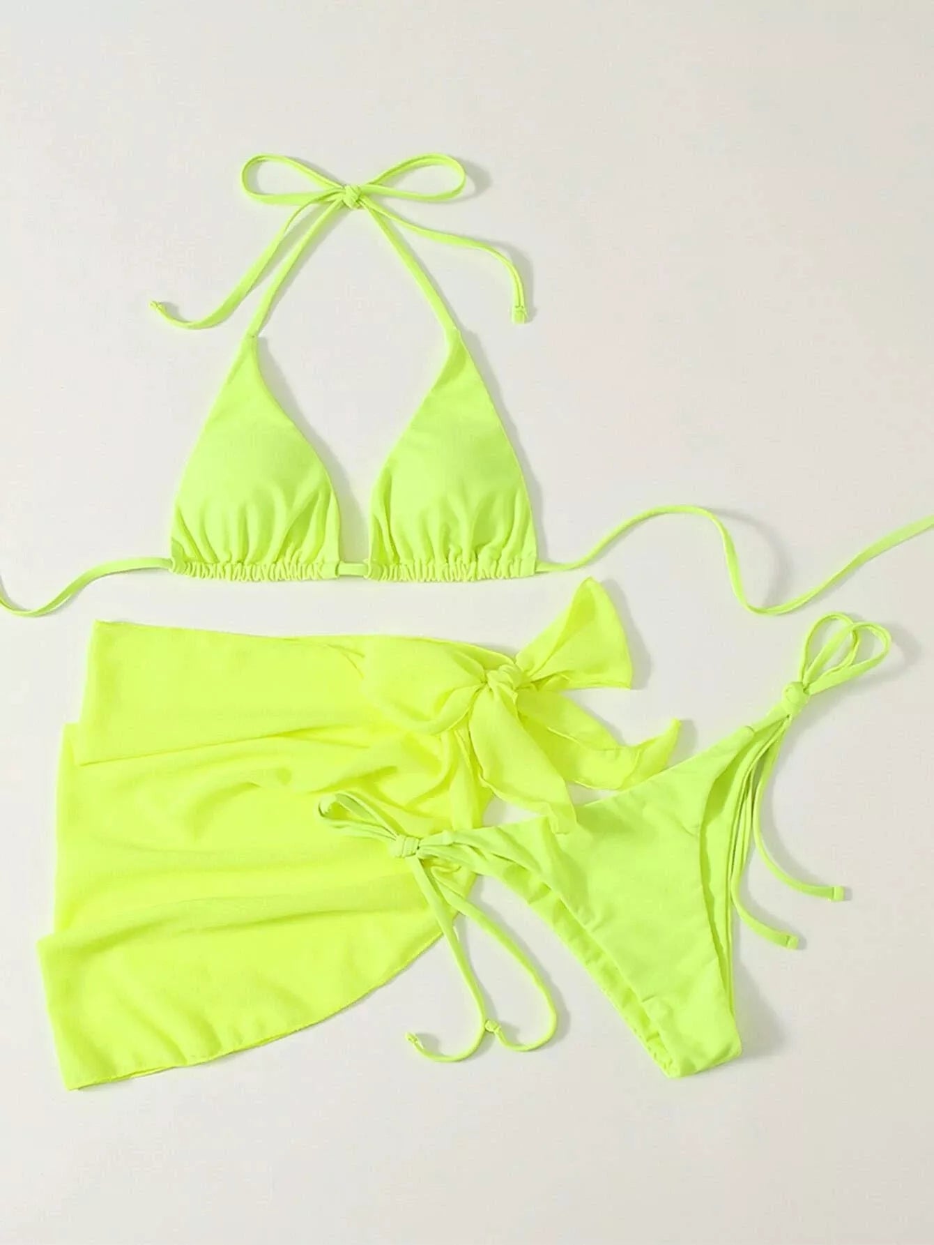 Women's three-piece mesh bikini swimsuit in vibrant colors, featuring a top, shorts, and skirt for versatile beachwear.