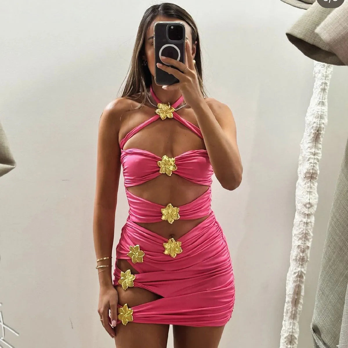 Solid colour women's one-piece swimsuit with hollow-out tube top and detachable short skirt on a mannequin.