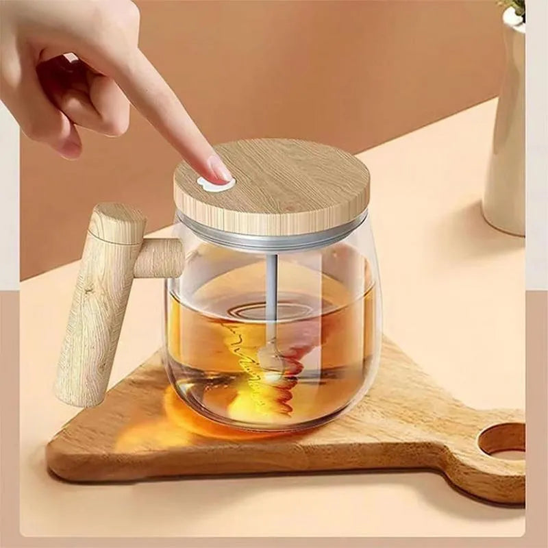 Clear borosilicate glass self-stirring coffee mug with 400ml capacity and electric mixing button