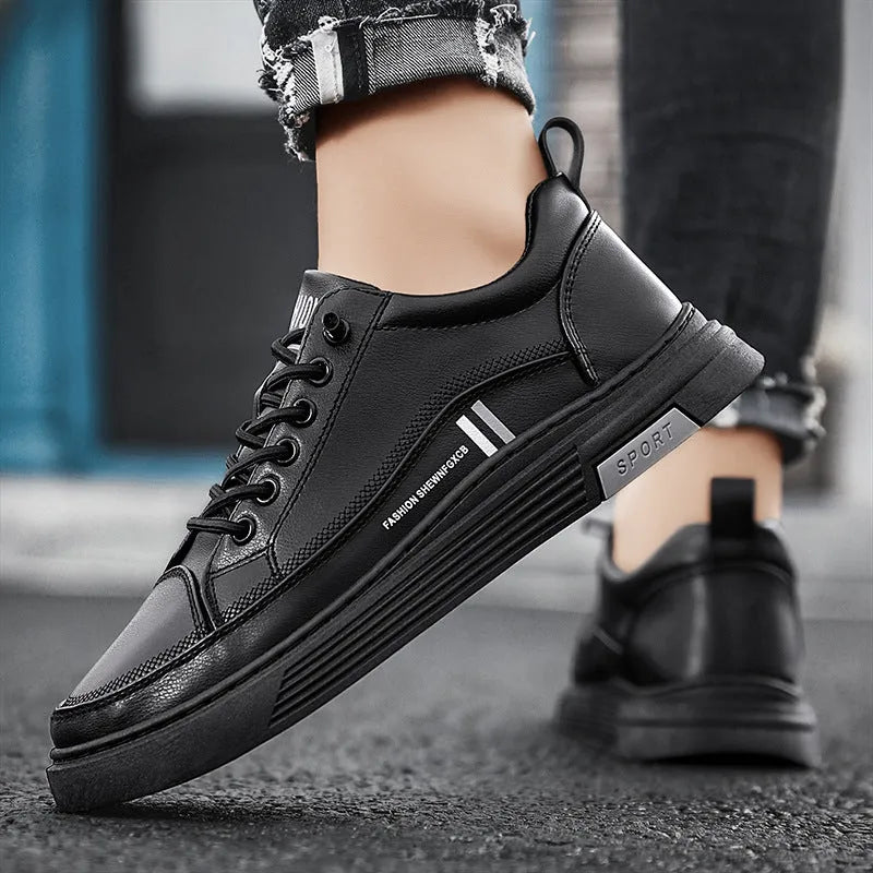 Men's low-top black and white skateboard shoes with elastic band and rubber sole.
