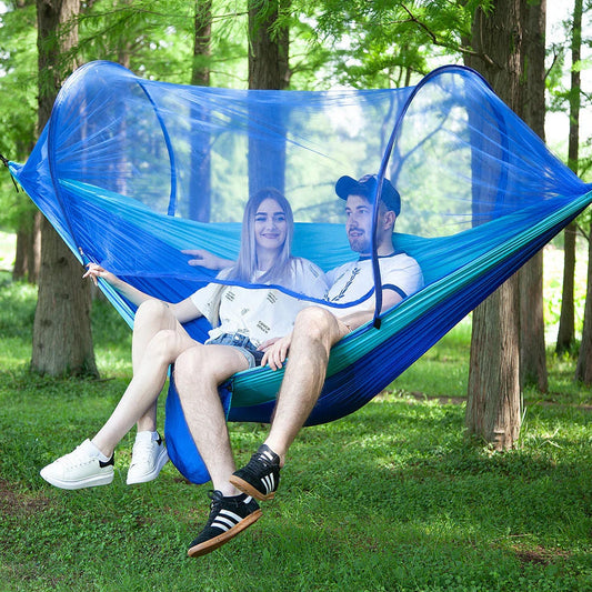 Cozy outdoor hammock with mosquito net for relaxing in nature and outdoor adventures