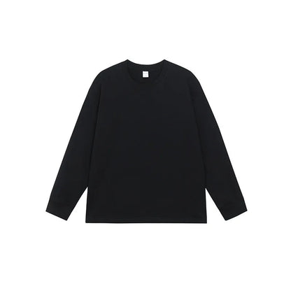 Man wearing a simple solid colour long sleeve cotton t-shirt in a loose, casual fit.