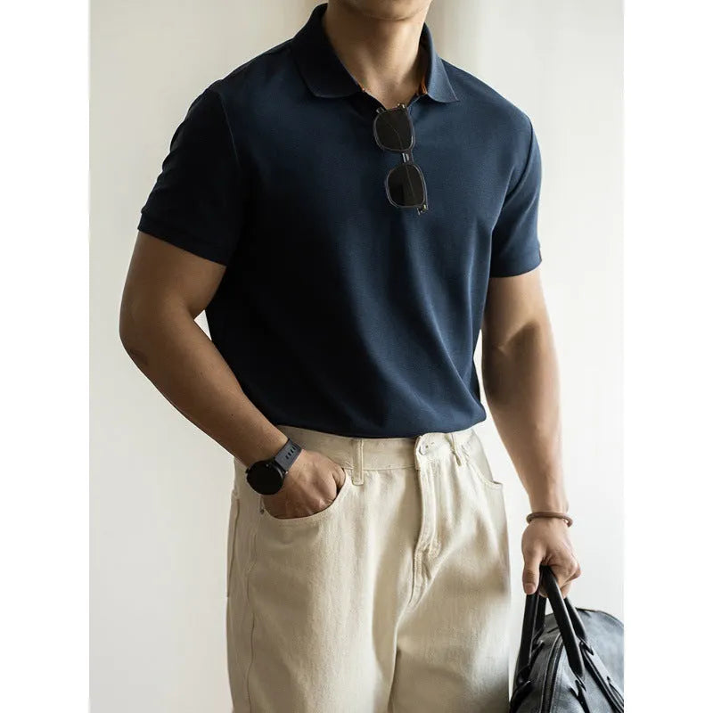 Light blue cotton polyester short-sleeved polo shirt on a hanger.
