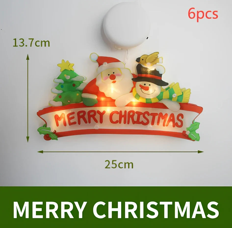 LED Christmas hanging lights with suction cups showing snowman design illuminated on window