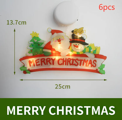 LED Christmas hanging lights with suction cups showing snowman design illuminated on window
