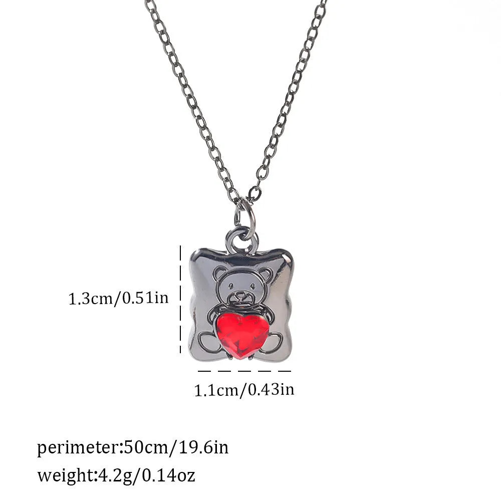 Gothic style zinc alloy necklace with bat pendant on a silver chain against dark background.