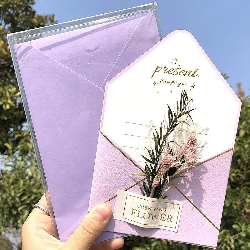 Handmade 3D pop-up greeting card with butterfly shape showing artificial flowers and hot stamping details