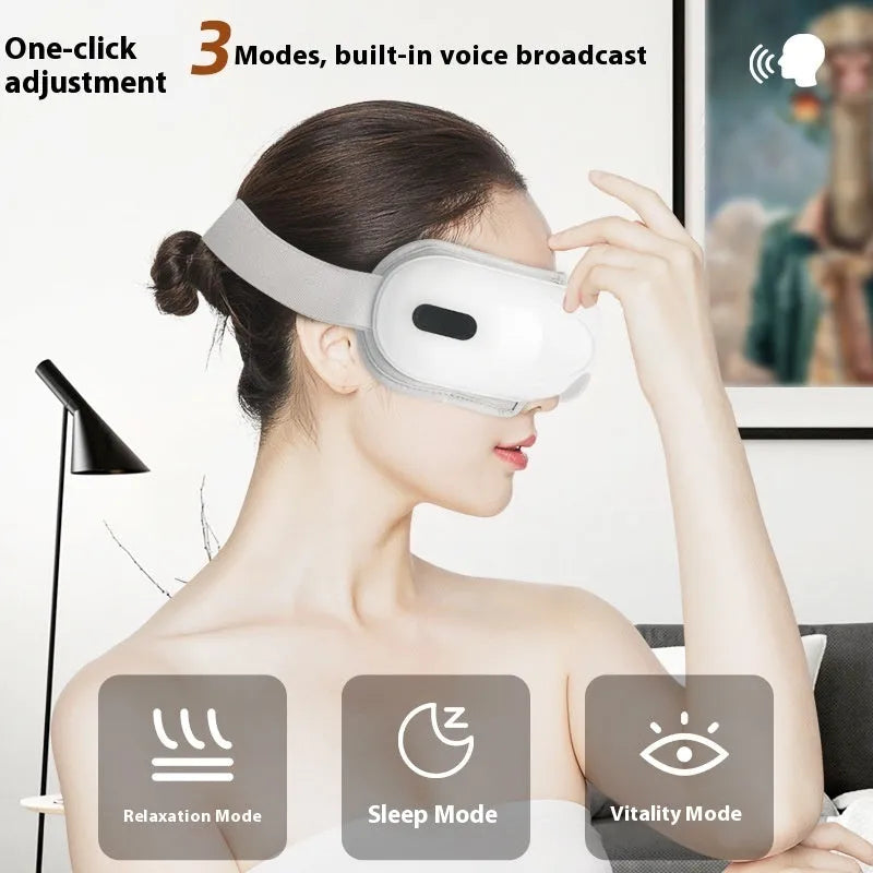 White rechargeable eye massager with airbag compression and hot compress functions, dimensions 140mm x 52mm x 150mm