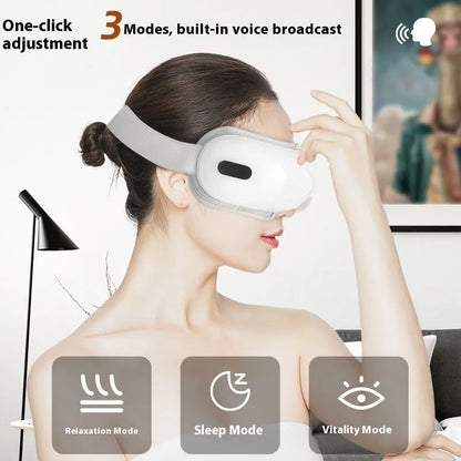 White rechargeable eye massager with airbag compression and hot compress functions, dimensions 140mm x 52mm x 150mm