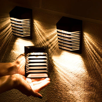 Black solar wall lamp with polycrystalline silicon panel measuring 90x20x53mm for outdoor garden lighting