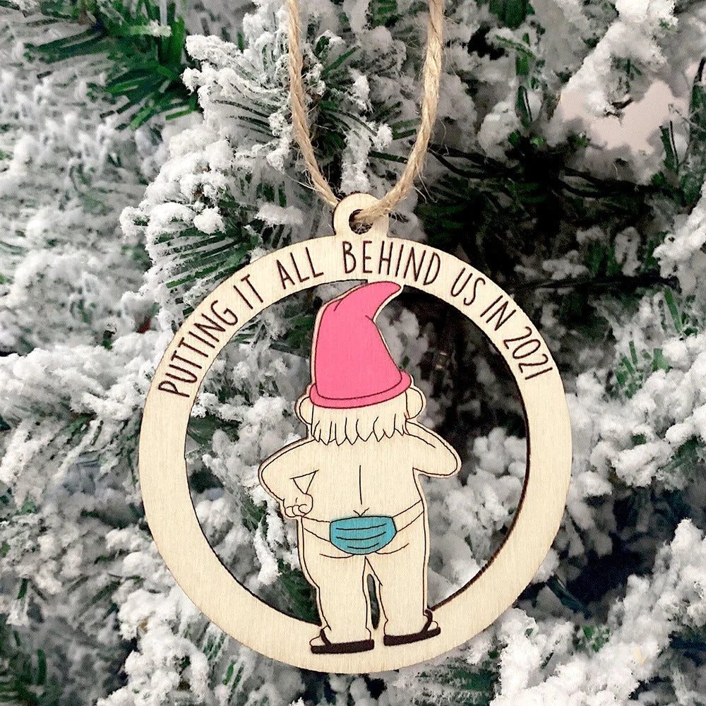 Wooden hollowed-out Christmas ornament with intricate snowman and deer laser-cut design