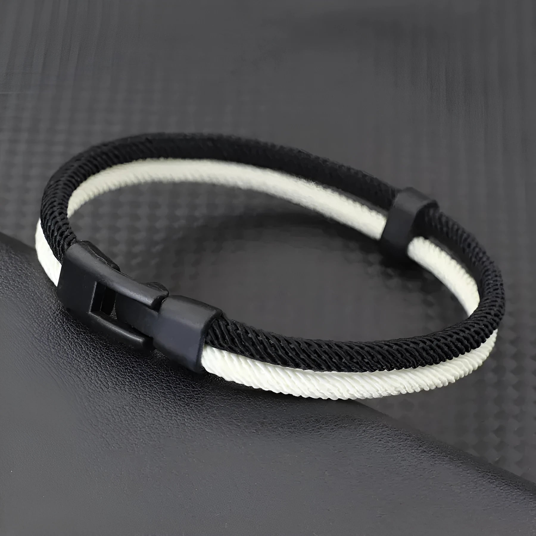 Black and white woven hand strap made from Milan rope alloy, shown at 19cm, 21cm, and 23cm lengths.
