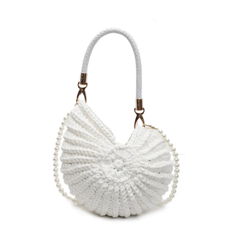 Handmade woven cloth bag with double shoulder straps in shell shape showing open pocket design