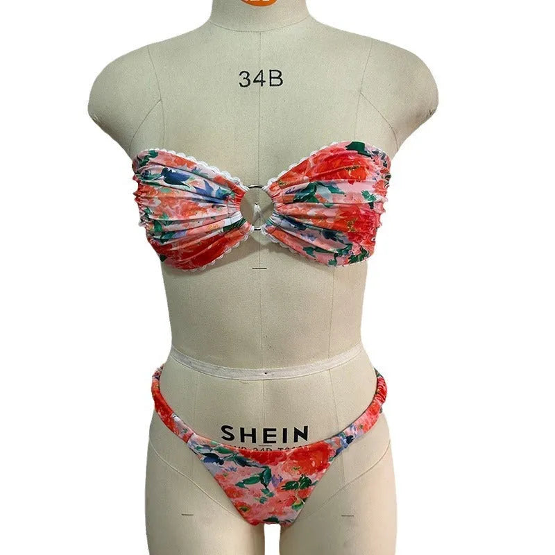 Colourful floral print tube top bikini set with lace trim on a mannequin