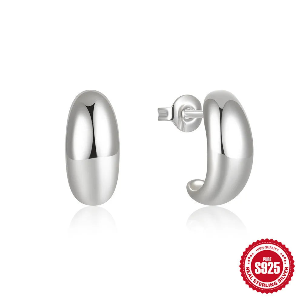 C-shaped sterling silver earrings with glossy electroplated finish in gold or white gold options
