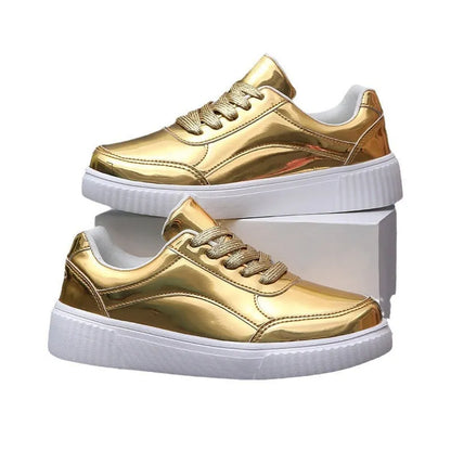 Rose gold and gold sequin platform sneakers with thick soles and round toe on a white background.