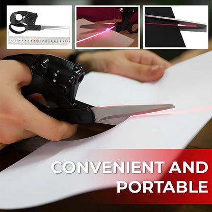 Black laser-guided scissors with red beam cutting straight line on wrapping paper