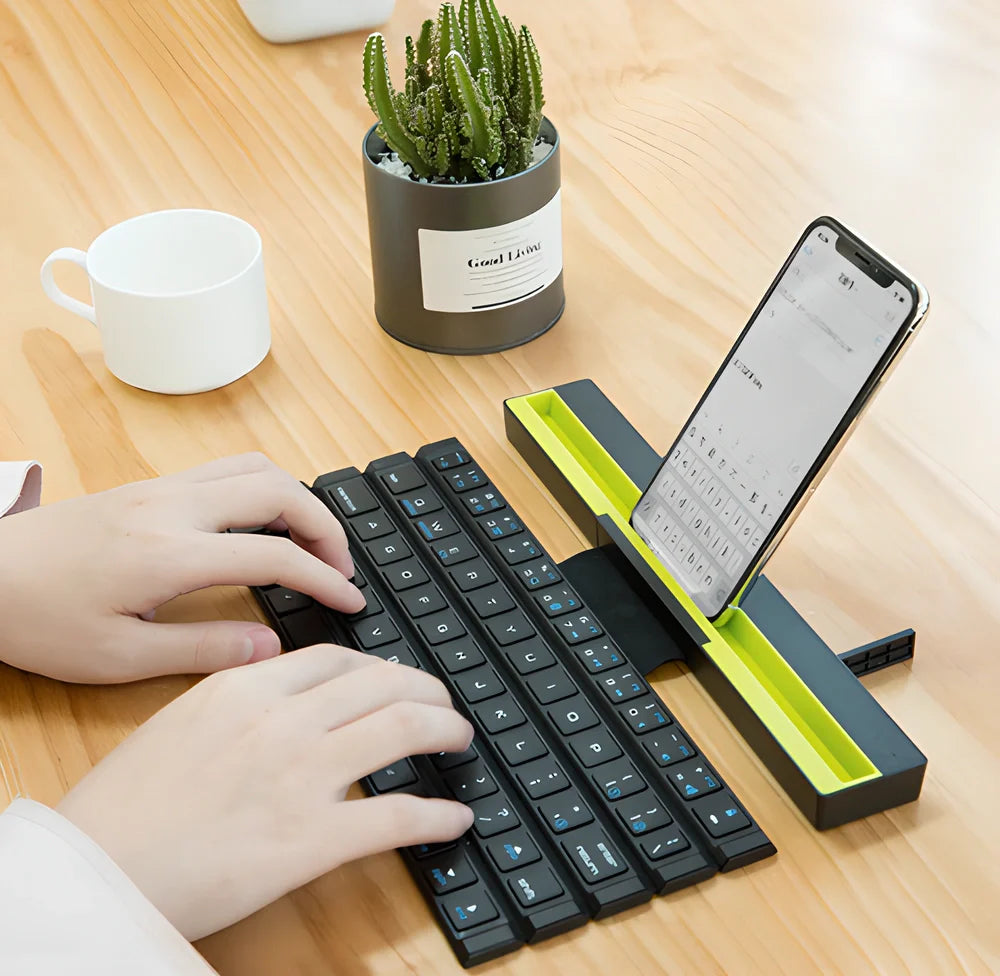 Portable wireless Bluetooth rolly keyboard with folding design and built-in device stand for tablets and smartphones
