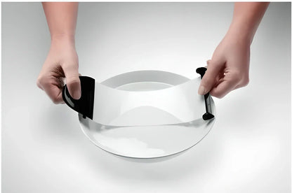 A sleek, compact sushi roller machine with black and transparent components for easy, effortless homemade sushi creation