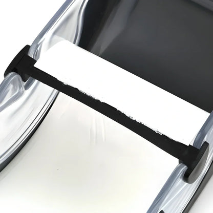 A sleek, compact sushi roller machine with black and transparent components for easy, effortless homemade sushi creation