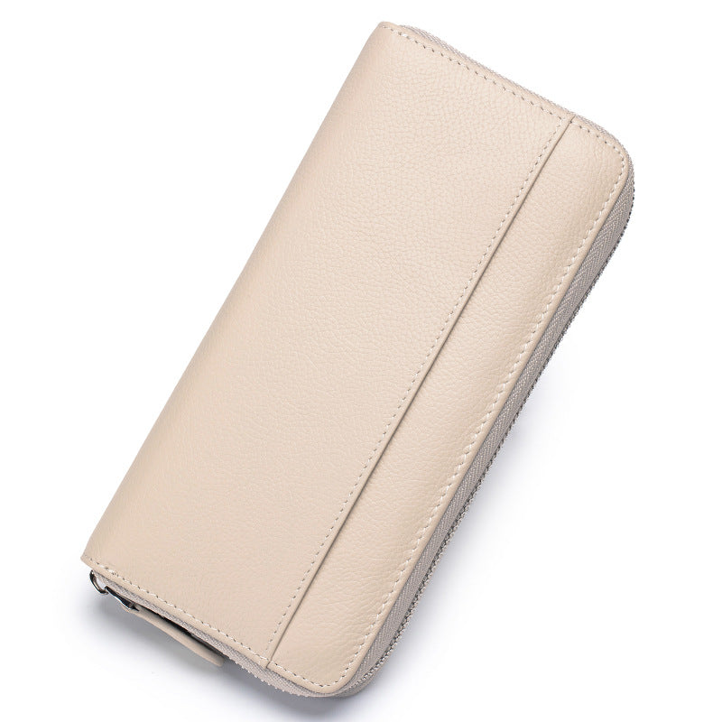 Long high-grade large-capacity wallet for women, crafted from genuine leather with 12 card slots, 2 bill compartments, and a coin zip pocket for organised storage and anti-theft card swiping protection.
